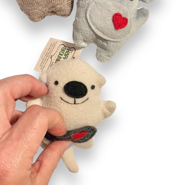 sea otter ornament with hand showing pocket
