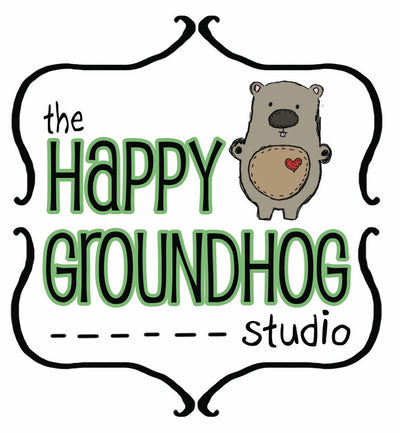 The Happy Groundhog Studio logo