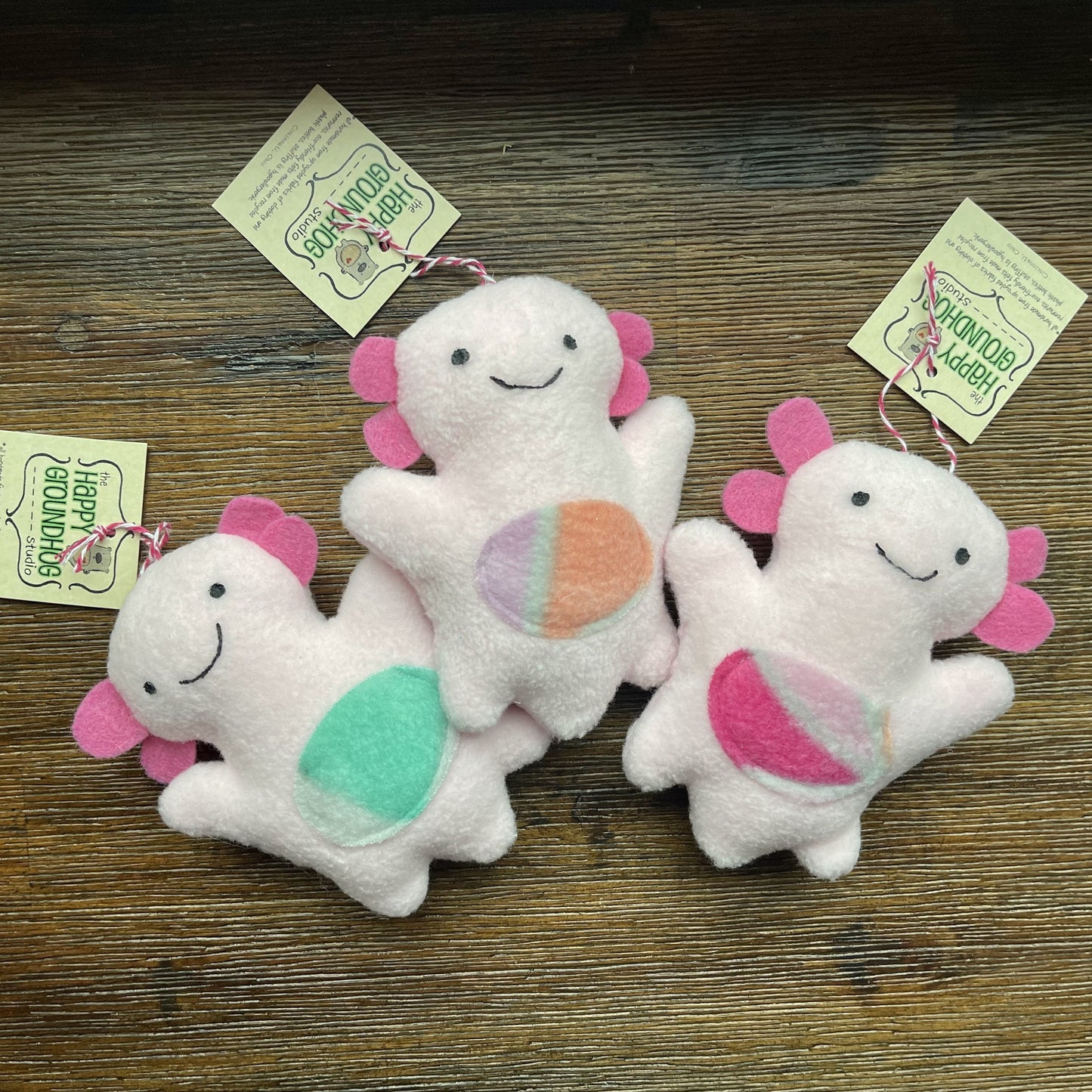 three different versions of axolotl ornaments s