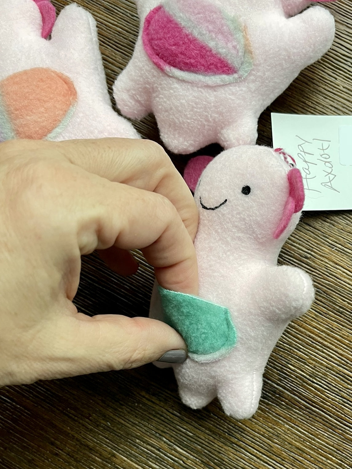 hand showing that axolotl ornament has a pocket