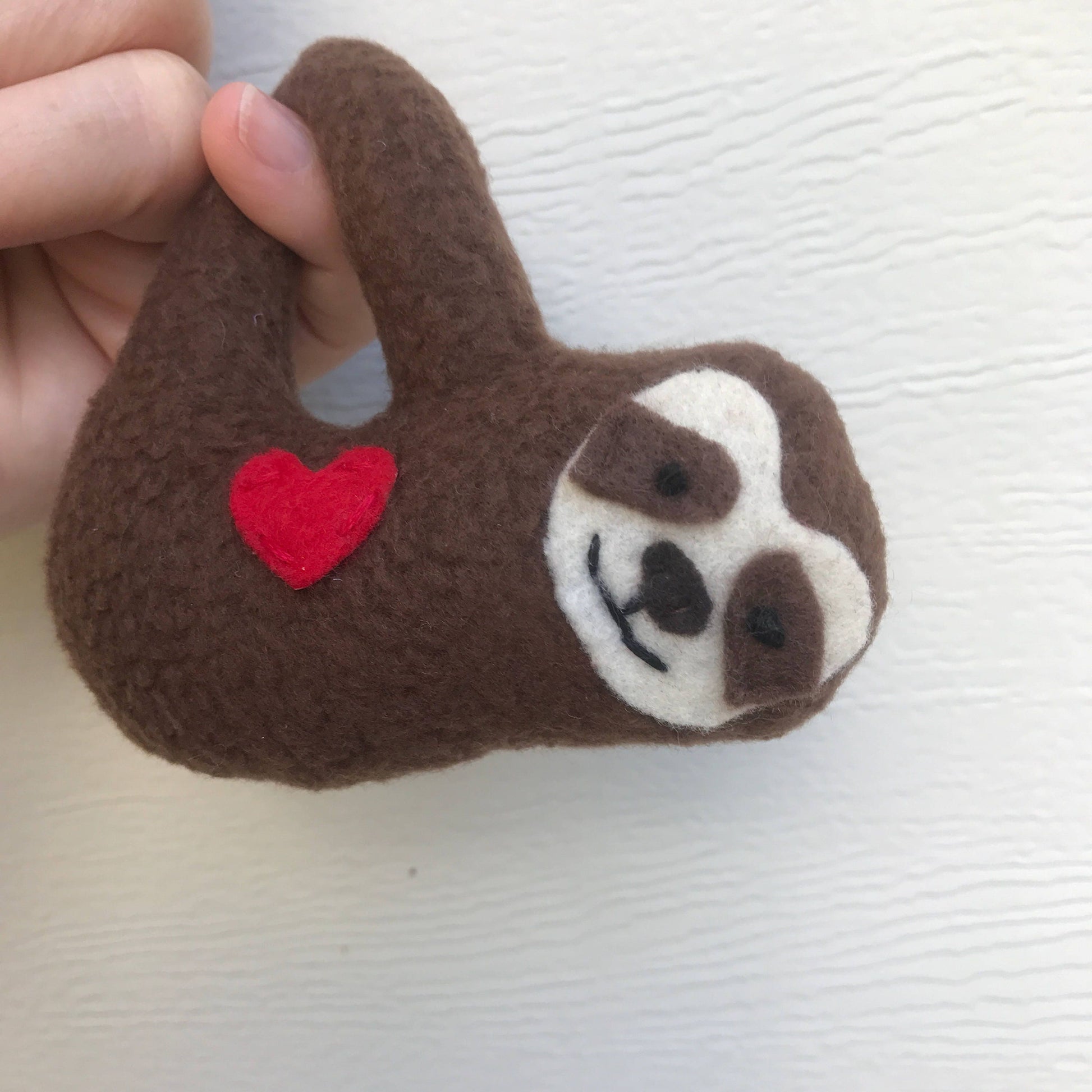 Sloth ornament handmade from recycled fabrics